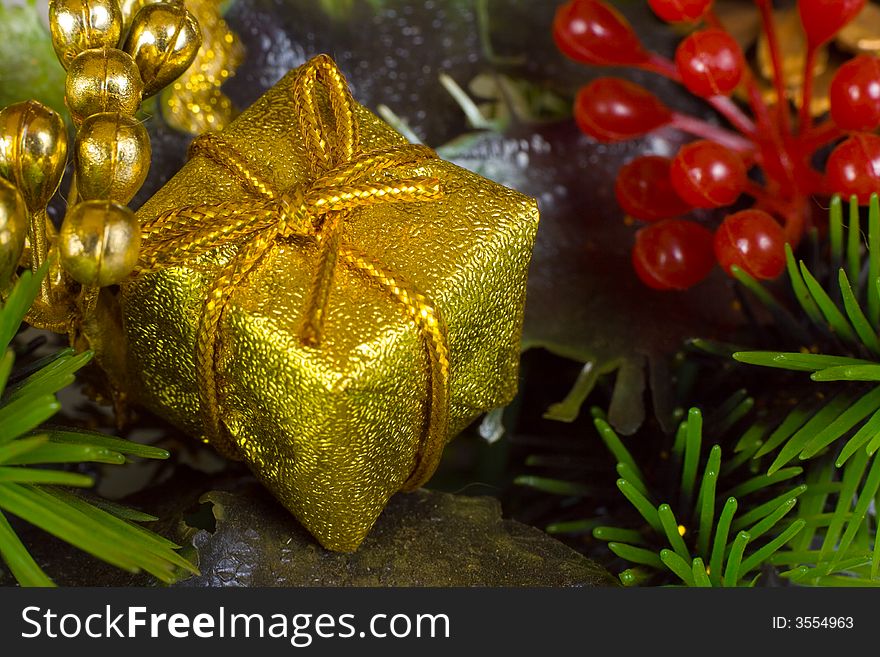 Gold gift, close-up, christmas background. Gold gift, close-up, christmas background