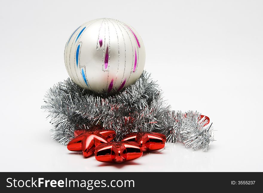 Red star shaped Christmas tree ornaments and glass ball on white background. Red star shaped Christmas tree ornaments and glass ball on white background