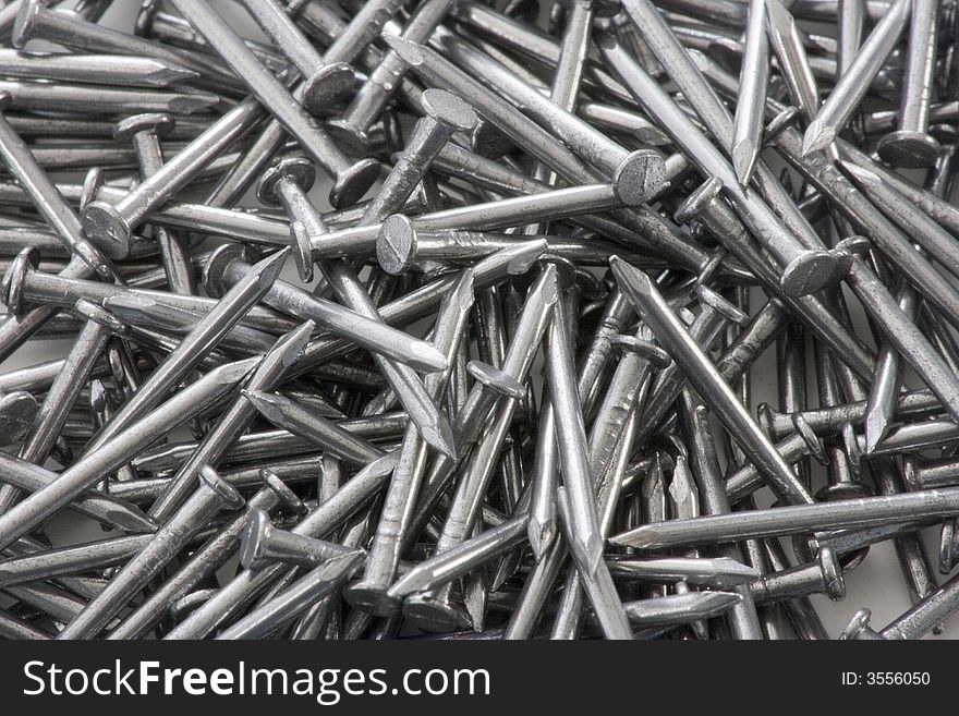 Closeup of a pile of steel nails.