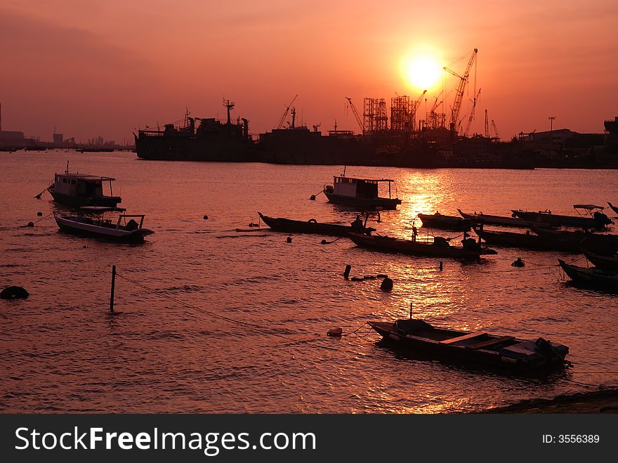 Boat And Sunset At The Seaside