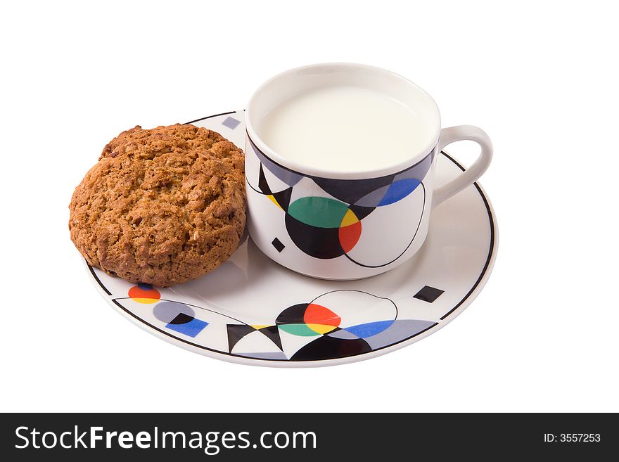 Milk and cookies on plate isolated