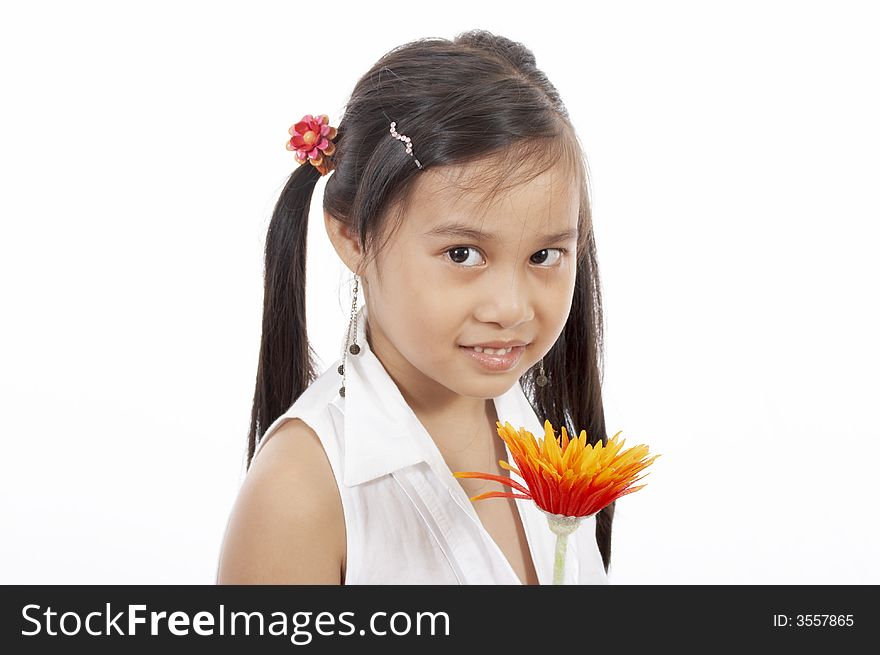 A young girl holding a flower over a white background. A young girl holding a flower over a white background