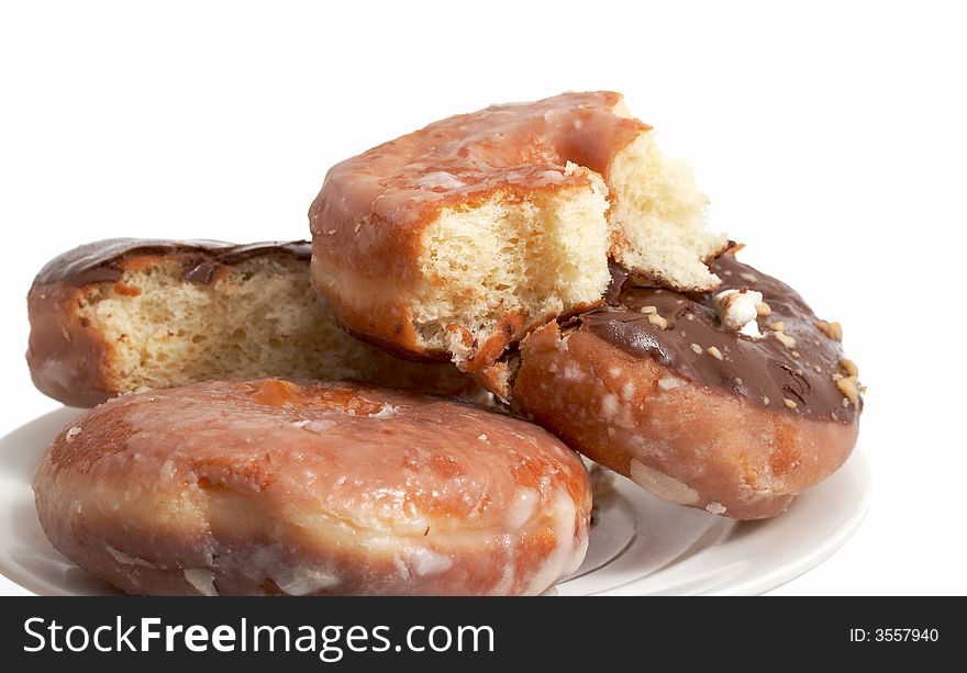 A plate of doughnuts over a white background