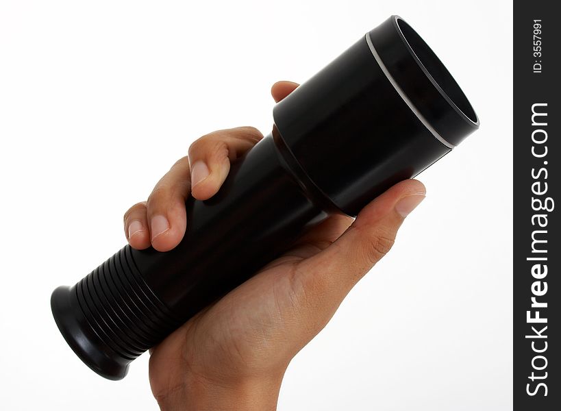 Holding a flashlight over a white background