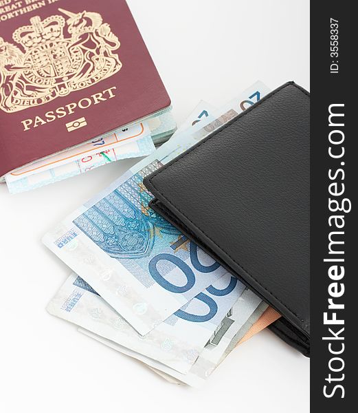 A passport and a wallet with euro bills. A passport and a wallet with euro bills