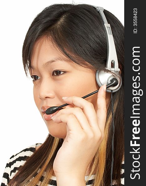 A woman with a headset on over a white background. A woman with a headset on over a white background