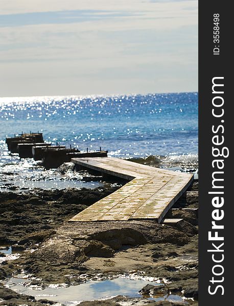 Cat-walk into the blue sea. Es Cavallet Ibiza, Spain. Cat-walk into the blue sea. Es Cavallet Ibiza, Spain