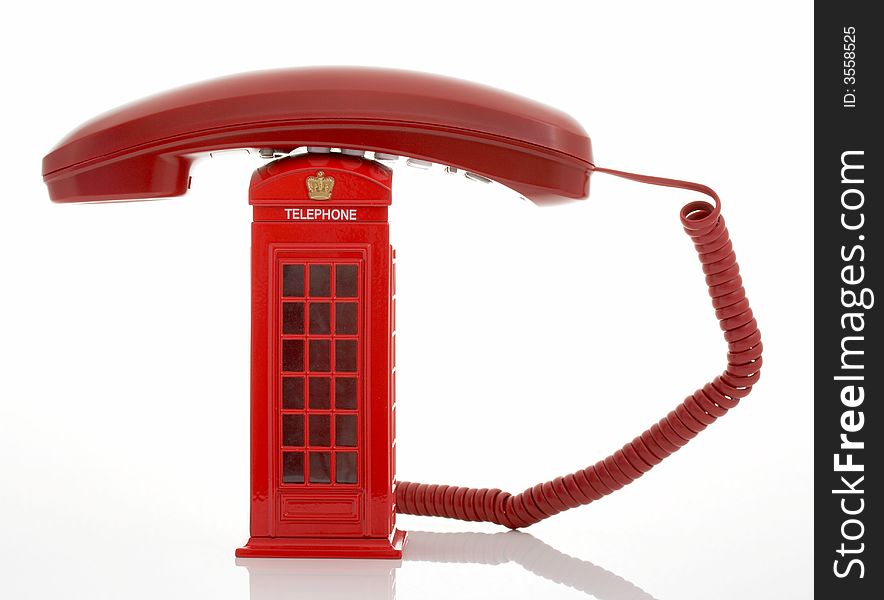 Photo of a red telephone over a white background