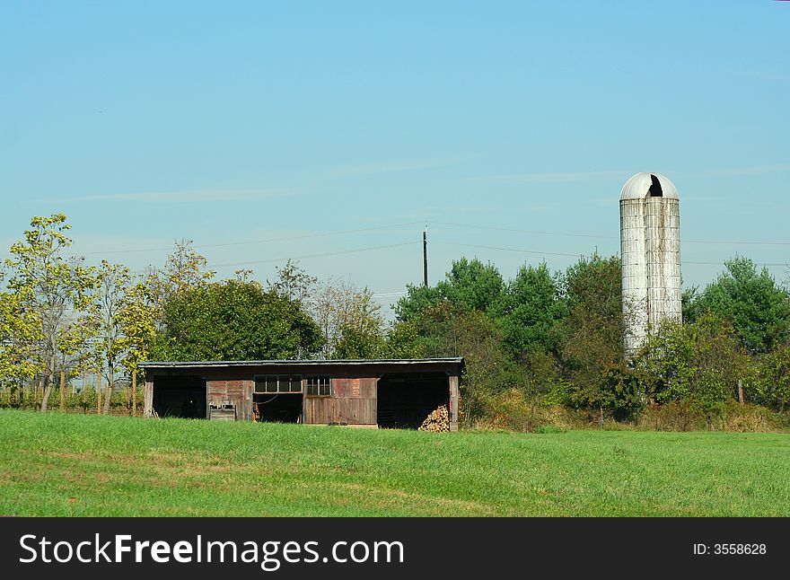 An old Barn and Silo with blue sky