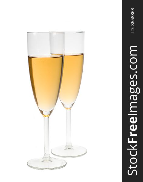 Two glasses filled with champagne isolated on a white background. Two glasses filled with champagne isolated on a white background