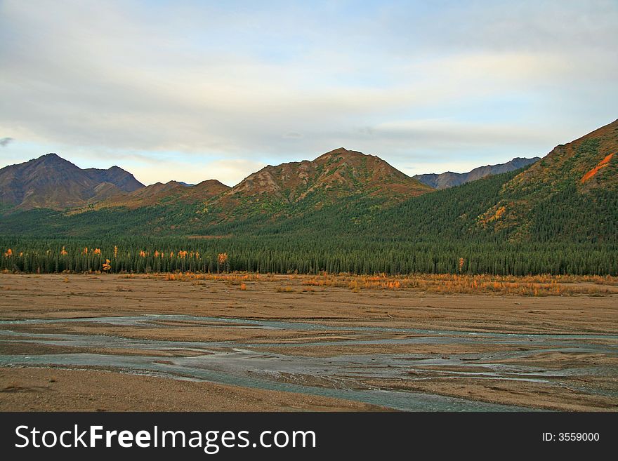 Alaska glacier bed with mountains in background