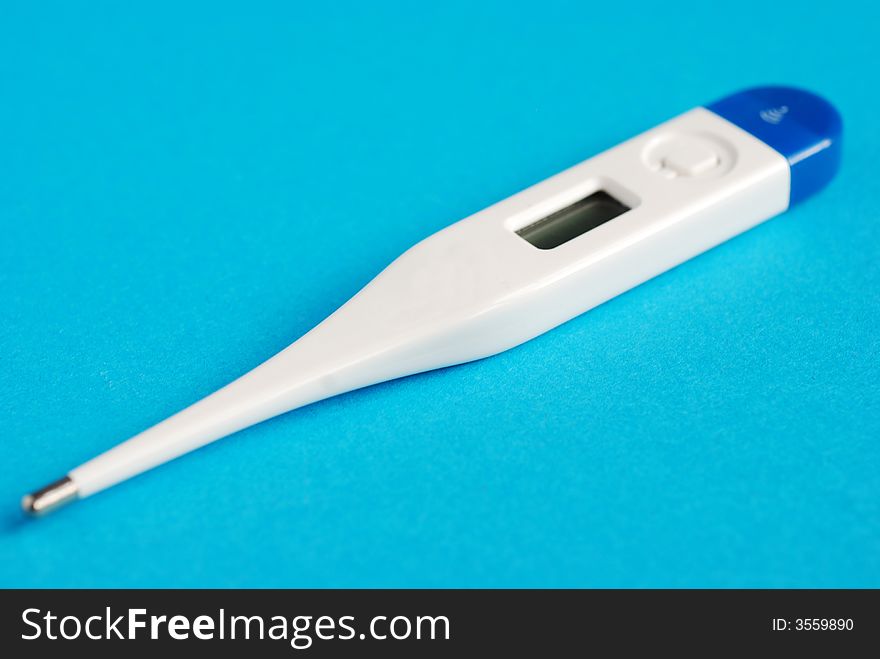 Digital thermometer on a blue background. Digital thermometer on a blue background