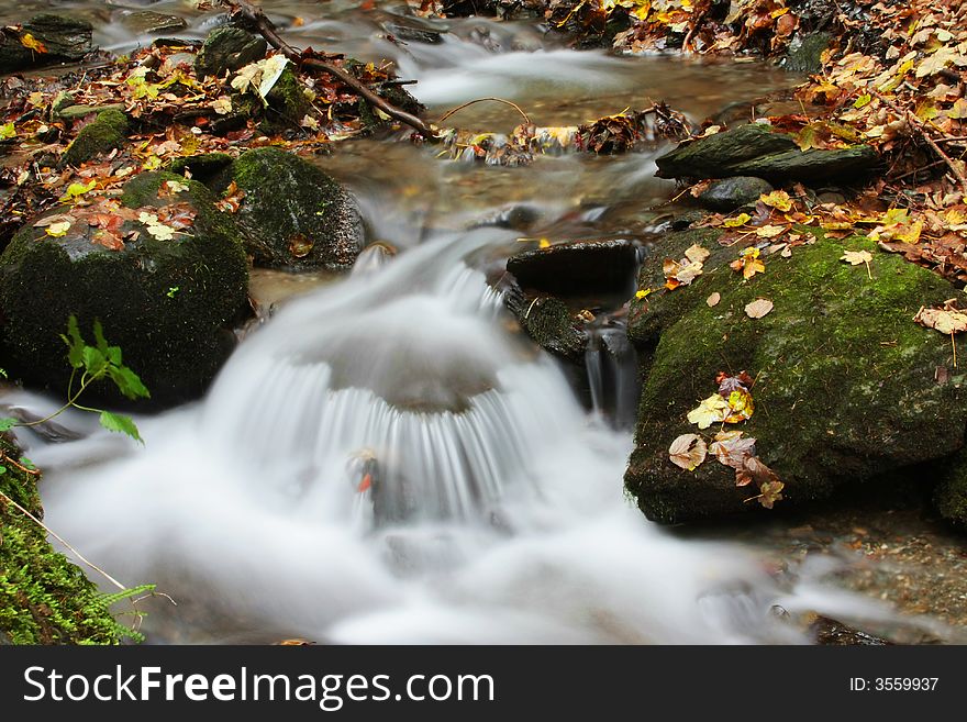 Detail of a small river, long-expsoure. Detail of a small river, long-expsoure