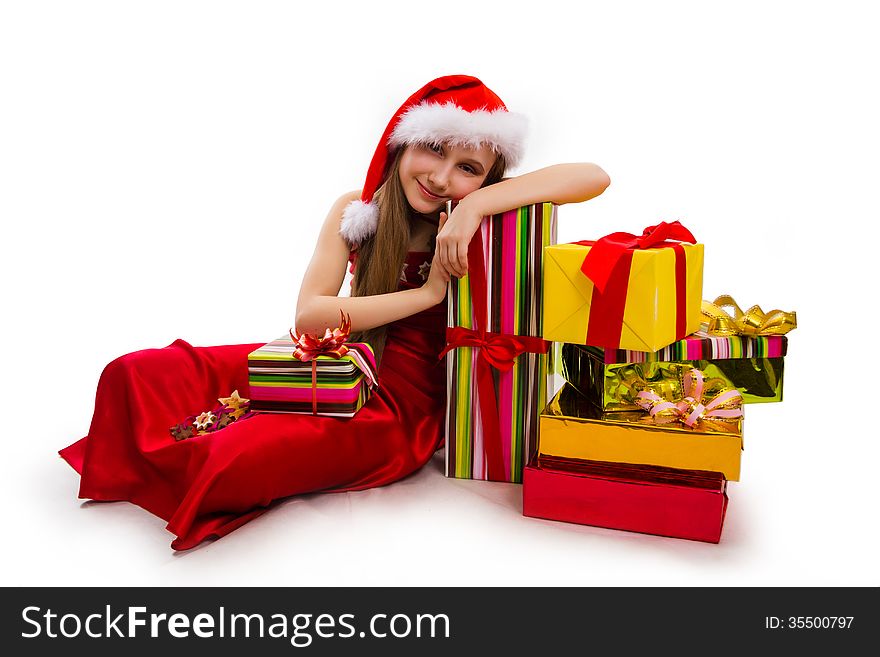 Christmas gifts and small girl Santa. Christmas gifts and small girl Santa