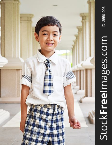 Happy student at school on walkway