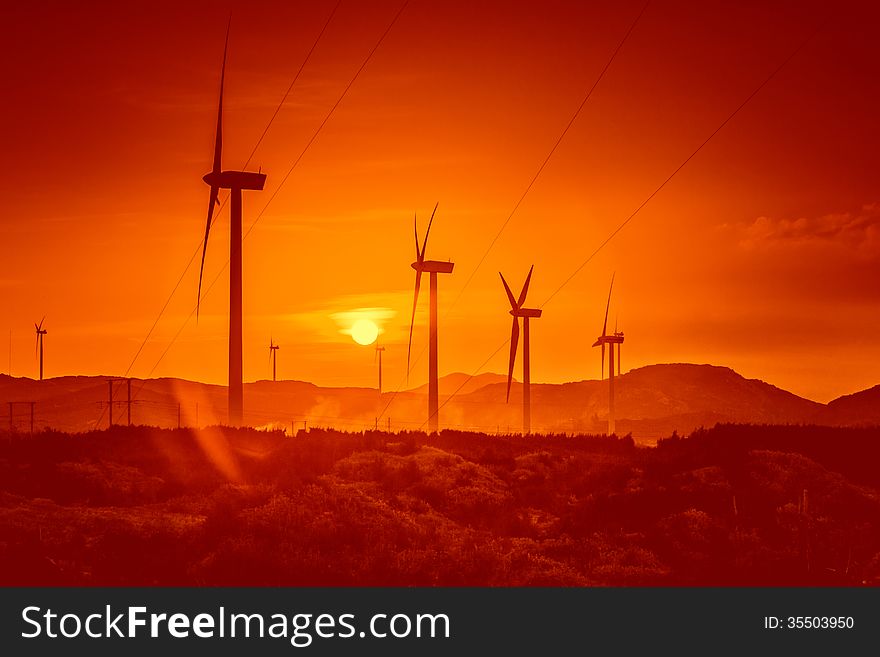 Wind turbines at sunset.