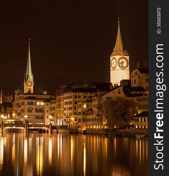 Zurich, Switzerland. The Limmat river, Lady Minster and St. Peter church, autumn evening. Zurich, Switzerland. The Limmat river, Lady Minster and St. Peter church, autumn evening