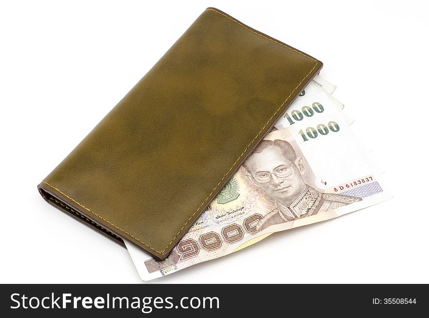 Thai banknote in brown wallet isolated on white background