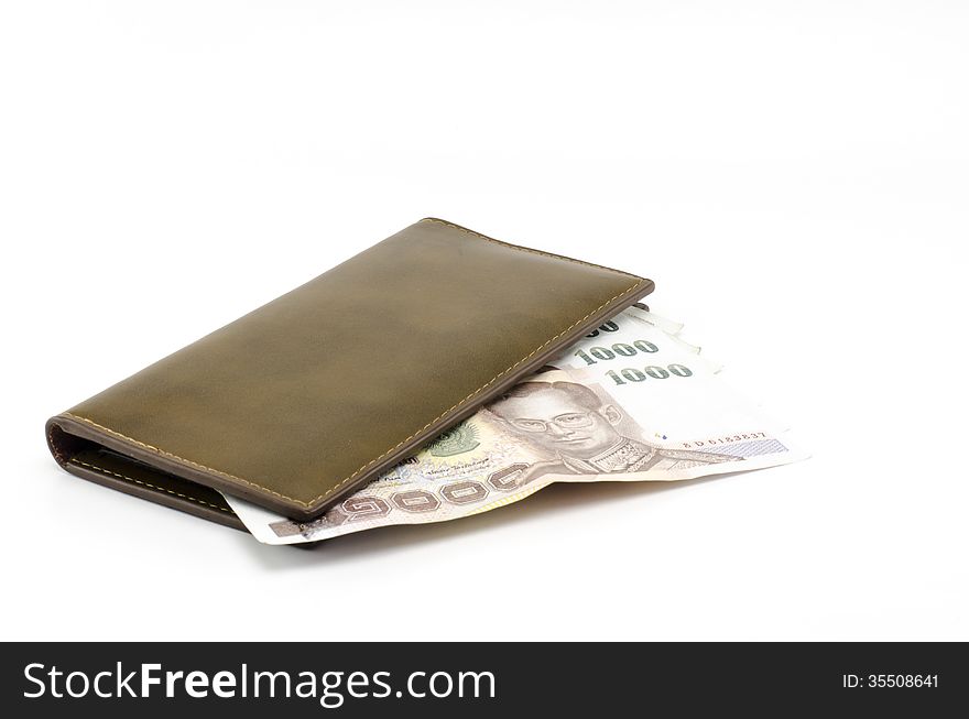 Thai banknote in brown wallet isolated on white background