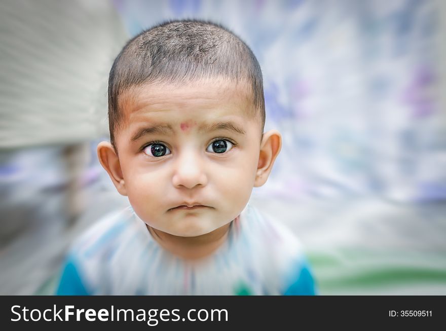 Portrait of cute baby boy looking at camera
