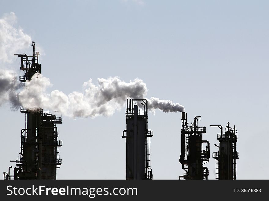 Industrial smoke from chimney in a refinery