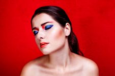 Beauty Close Up Portrait Of Woman With Colorful Makeup On Red Backround Royalty Free Stock Images