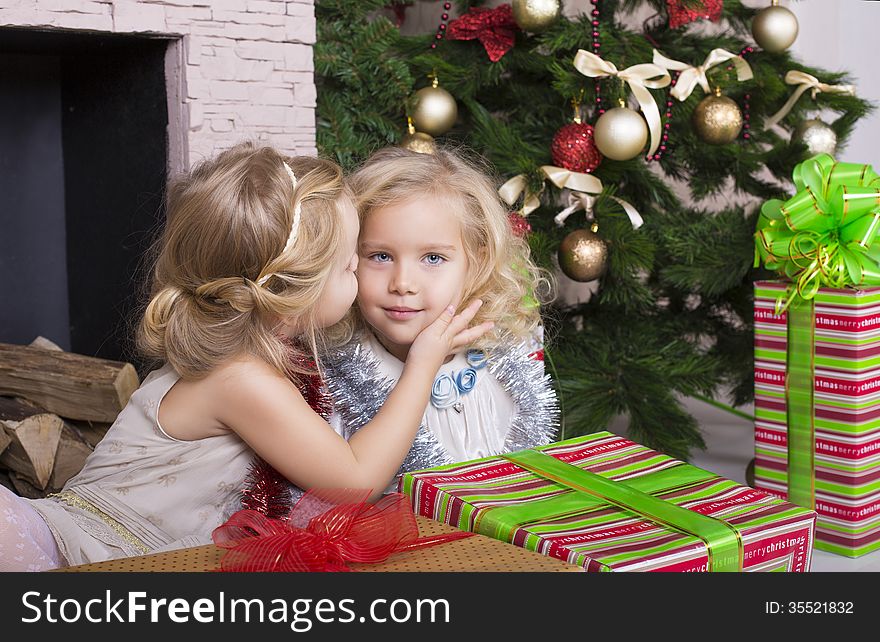 Funny little girls with Christmas gifts. Funny little girls with Christmas gifts
