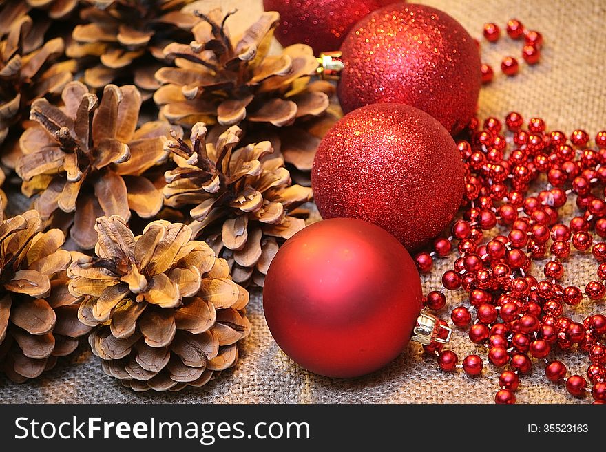 Christmas background - red balls, pine cone