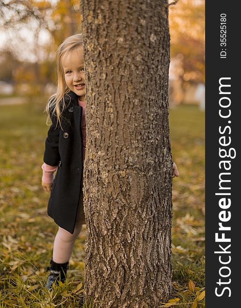 Funny little girl in park. Funny little girl in park