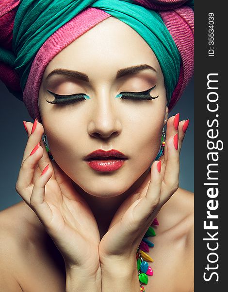 Beautiful lady with multi-colored turban and necklace. Beautiful lady with multi-colored turban and necklace