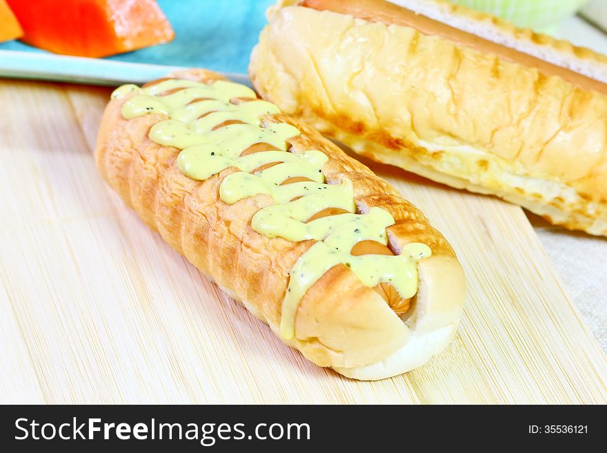 Closeup hot dog with mustard relish sauce