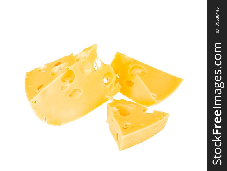 Three pieces of yellow cheese with holes in isolation