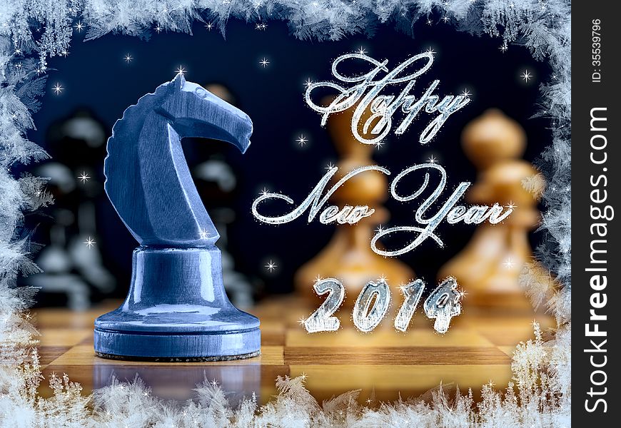 New Year's composition of 2014 from chessmen with a dark blue wooden horse. New Year's composition of 2014 from chessmen with a dark blue wooden horse