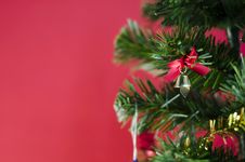 Small Bell On Christmas Tree On Red Background Royalty Free Stock Photos Small Bell On Christmas Tree On Red Background Royalty Free Stock Photos