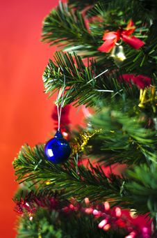 Blue Christmas Ball On Tree On Red Background Royalty Free Stock Photos