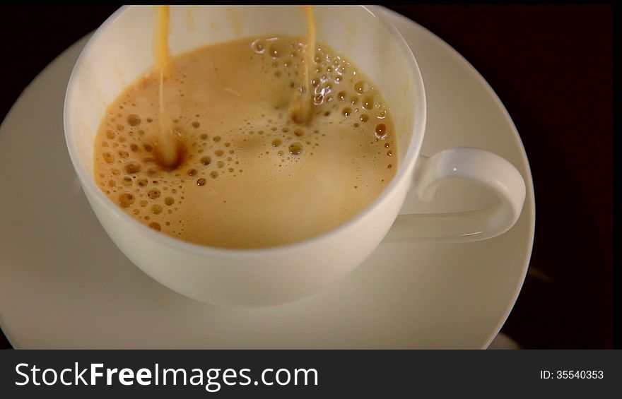 Coffee pouring into a cup. Coffee pouring into a cup