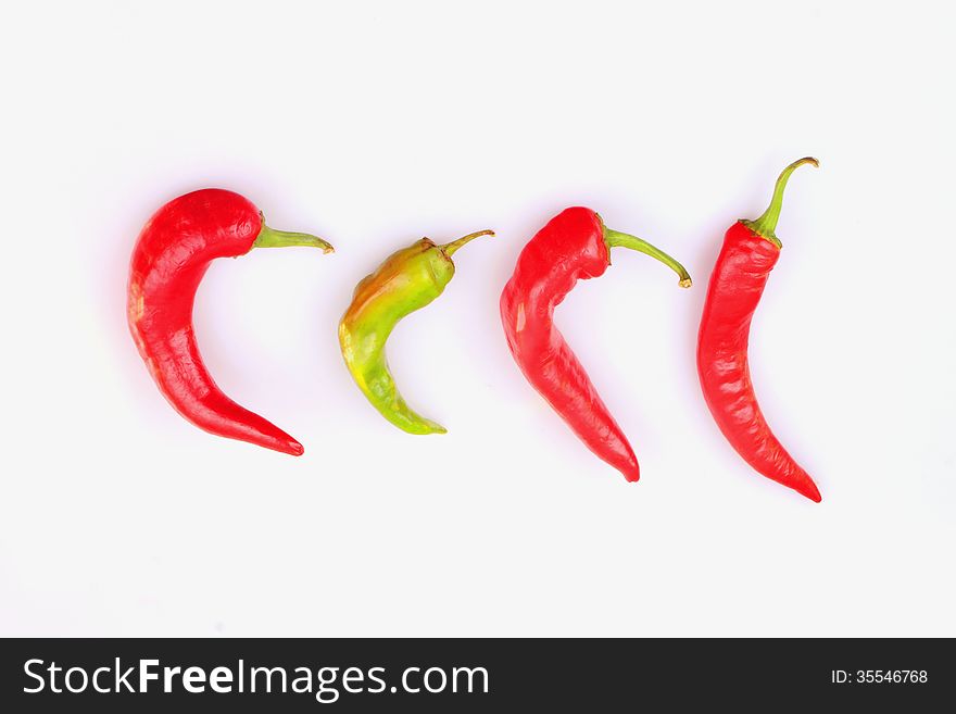 Red hot peppers on white background