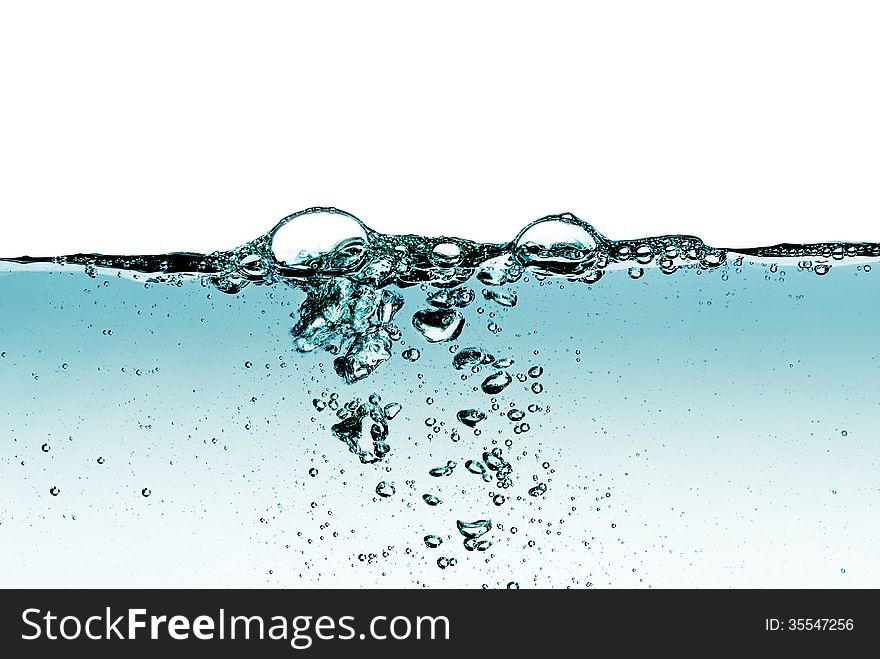 A splash of water,drops and bubbles on a white background. A splash of water,drops and bubbles on a white background