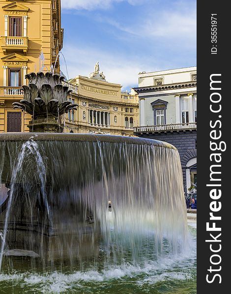 View of the fountain of the artichoke in Trieste e Trento Square and in the background the Umberto I gallery. View of the fountain of the artichoke in Trieste e Trento Square and in the background the Umberto I gallery