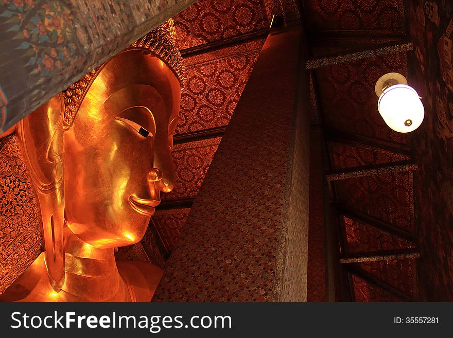 Reclining Buddha gold statue at Wat Pho, Bangkok, Thailand