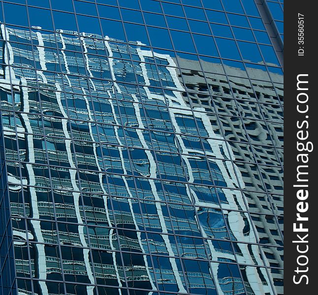 Business buildings reflecting onto glass. Business buildings reflecting onto glass
