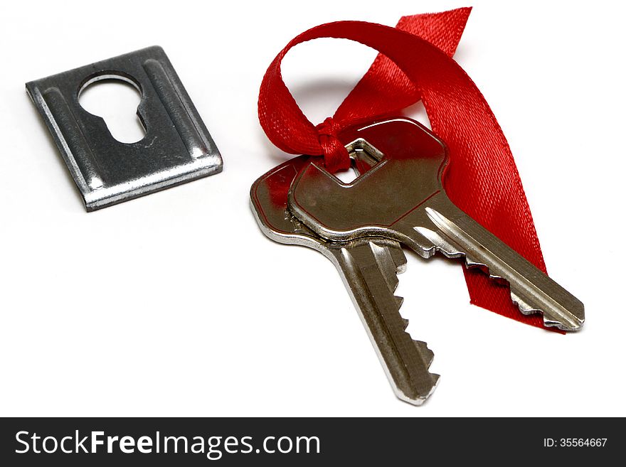 A bunch of keys and keyhole isolated on white background