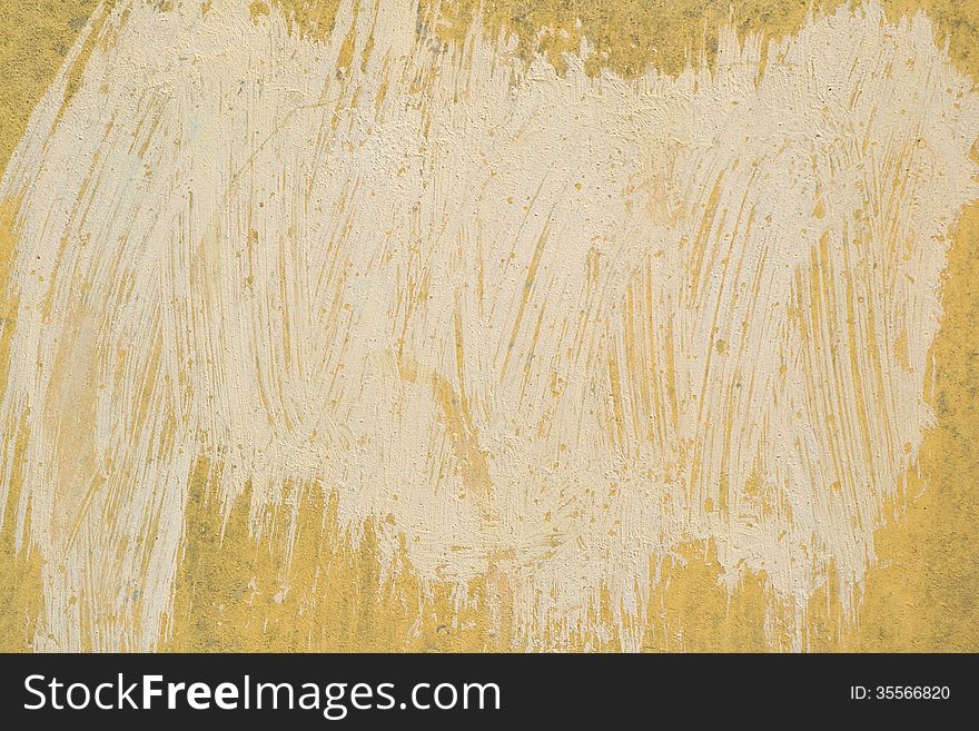 Fragment of yellow grunge painted wall. Fragment of yellow grunge painted wall.