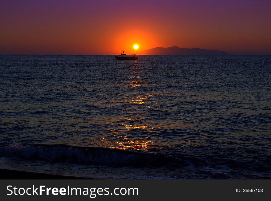 Sunrise.Picture taken at Kamari village beach,Santorini island -one heavenly place. Sunrise.Picture taken at Kamari village beach,Santorini island -one heavenly place.