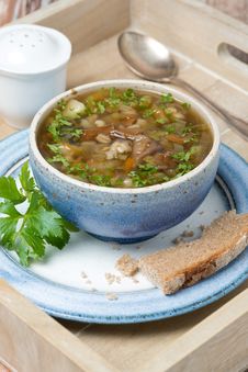 Bowl Of Mushroom Soup With Pearl Barley On A Wooden Tray Stock Photography Bowl Of Mushroom Soup With Pearl Barley On A Wooden Tray Stock Photography