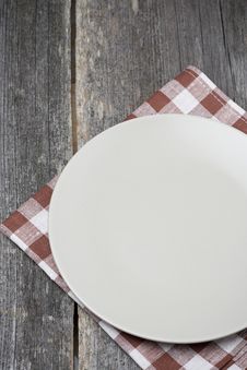 Empty Plate On A Napkin On Wooden Table, Concept Stock Images