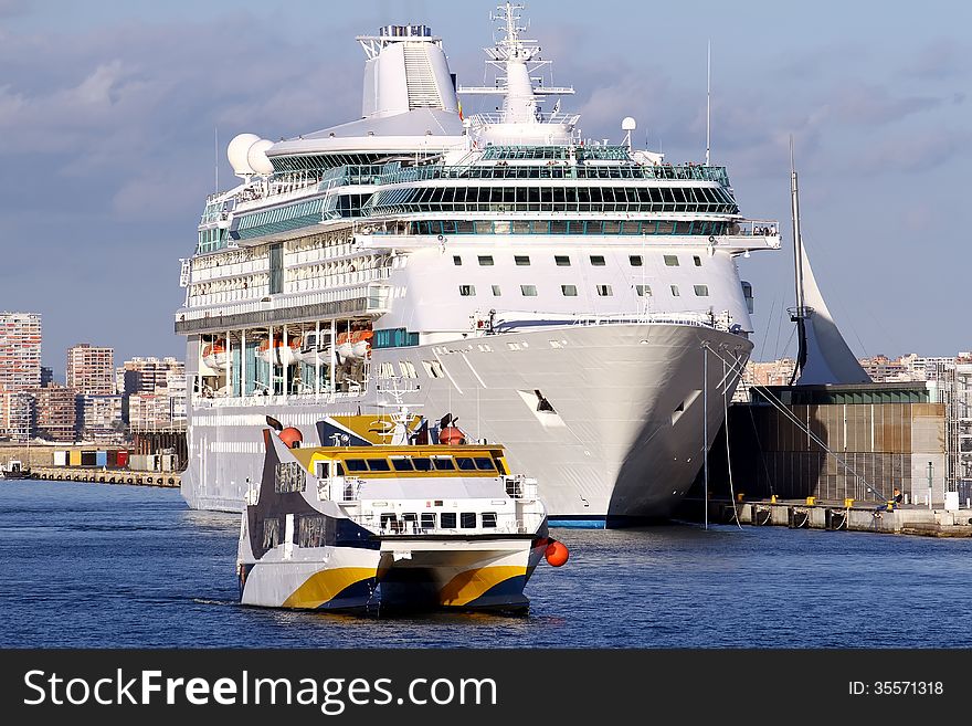 Modern cruise and touristic ferry in Alicante harbor