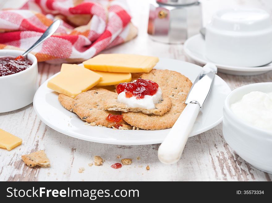 Delicious Breakfast With Crackers, Cream Cheese And Berry Jam