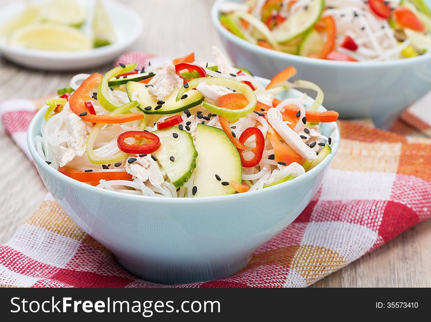Delicious Thai salad with vegetables, noodles and chicken