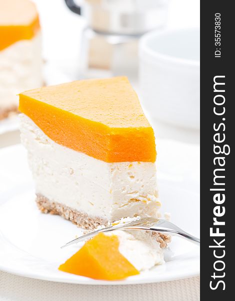 Piece of cheesecake with pumpkin jelly, vertical, top view. Piece of cheesecake with pumpkin jelly, vertical, top view